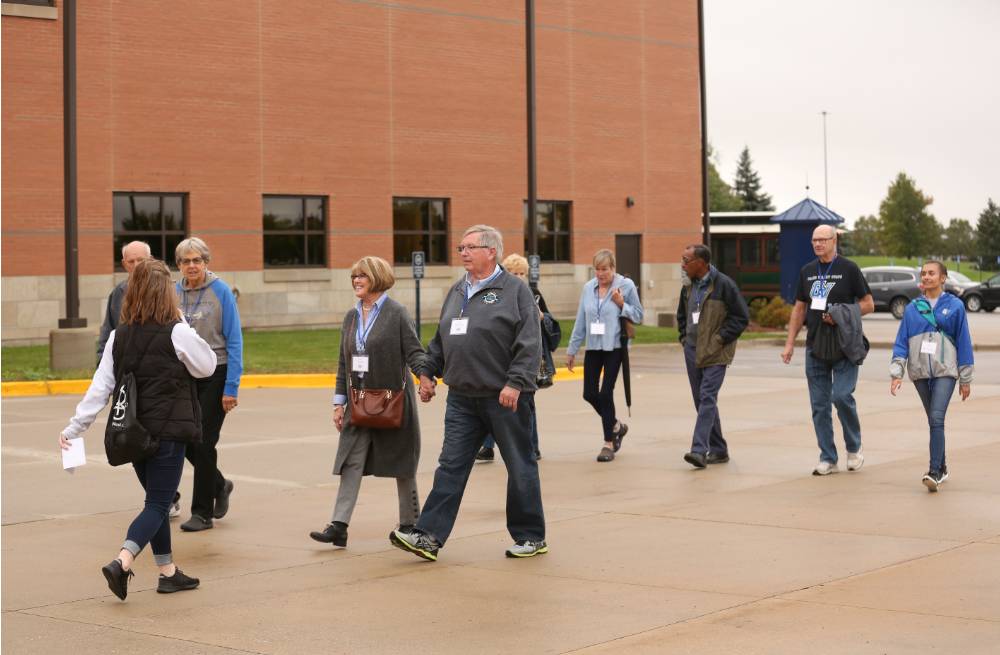 Class of '68 takes a tour outside the buildings of Kindschi Hall and the Recreation Center.